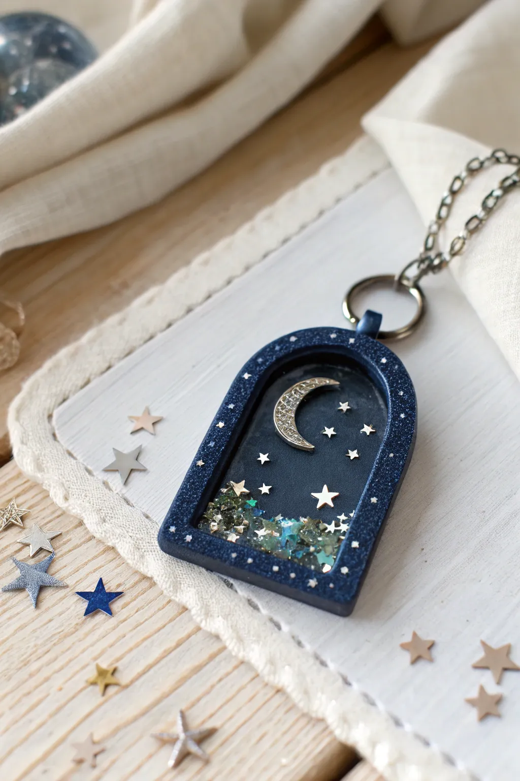 Starry Night glitter shaker charm in deep navy, moon and stars frame, subtle boho sparkle.