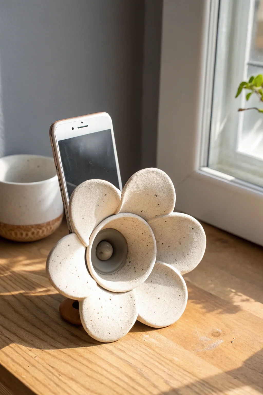 Flower bloom clay speaker: minimalist, handmade megaphone charm with soft boho warmth.