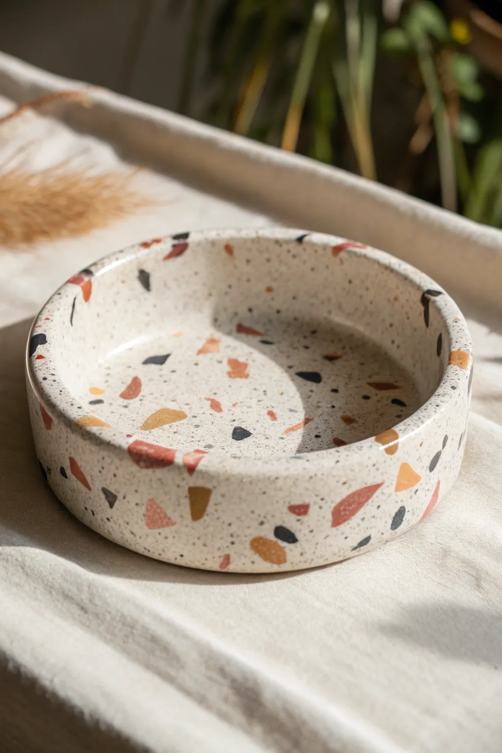 Minimal terrazzo speckle clay ashtray in soft neutrals with bold chips and clean notches