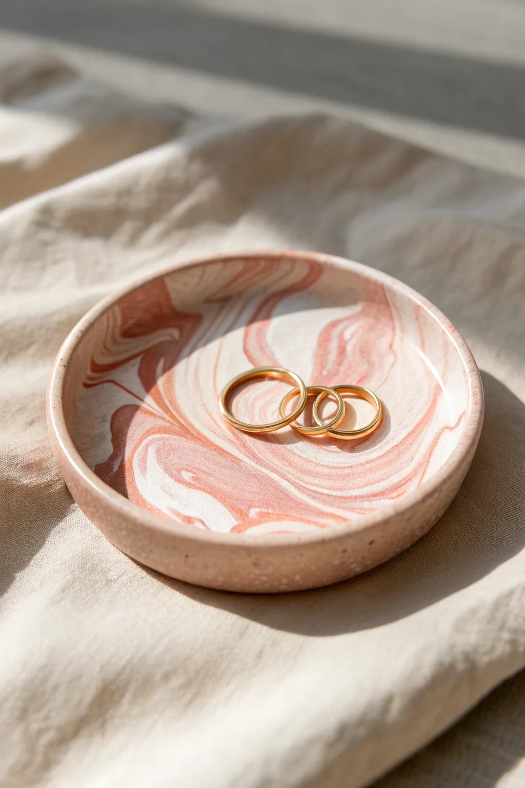 Swirly polymer clay trinket dish in soft blush tones, perfect for rings and tiny treasures