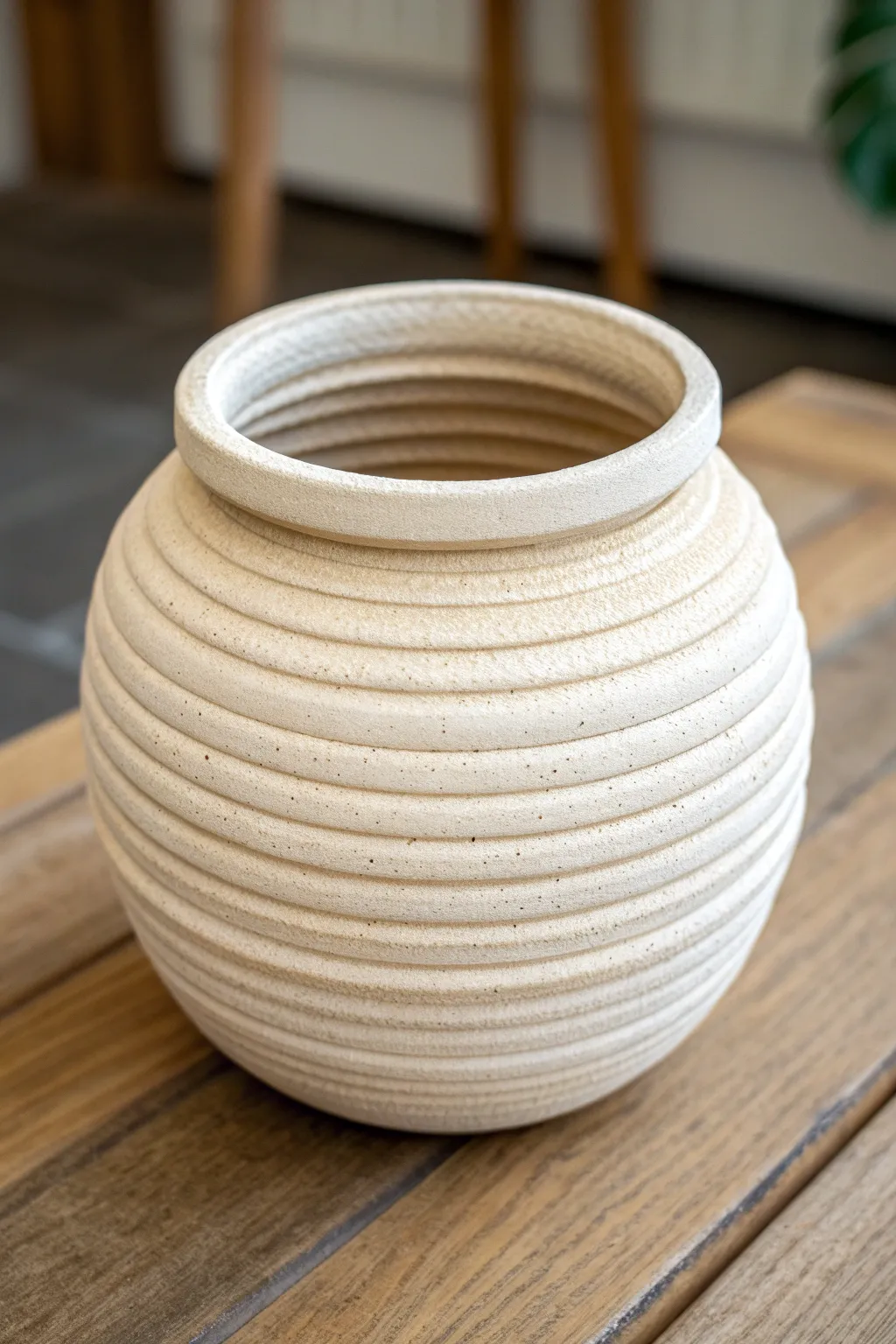 Visible-coil pottery with a clean rim and glaze breaks that highlight every ridge