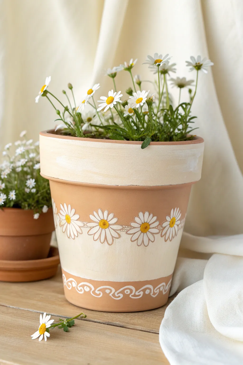 Sweet daisy band detail on a minimalist terra cotta pot with a soft boho, handmade feel
