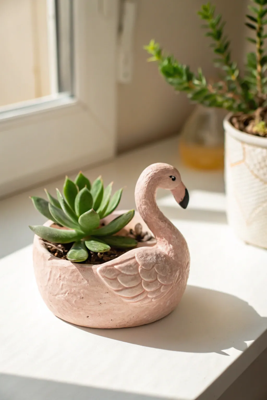 Blush pink flamingo mini planter in air dry clay, a simple pop of color for tiny succulents.