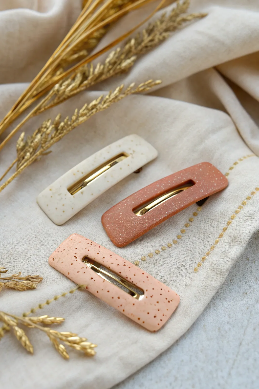 Minimalist polymer clay barrettes in soft neutrals, a chic DIY accessory collection.