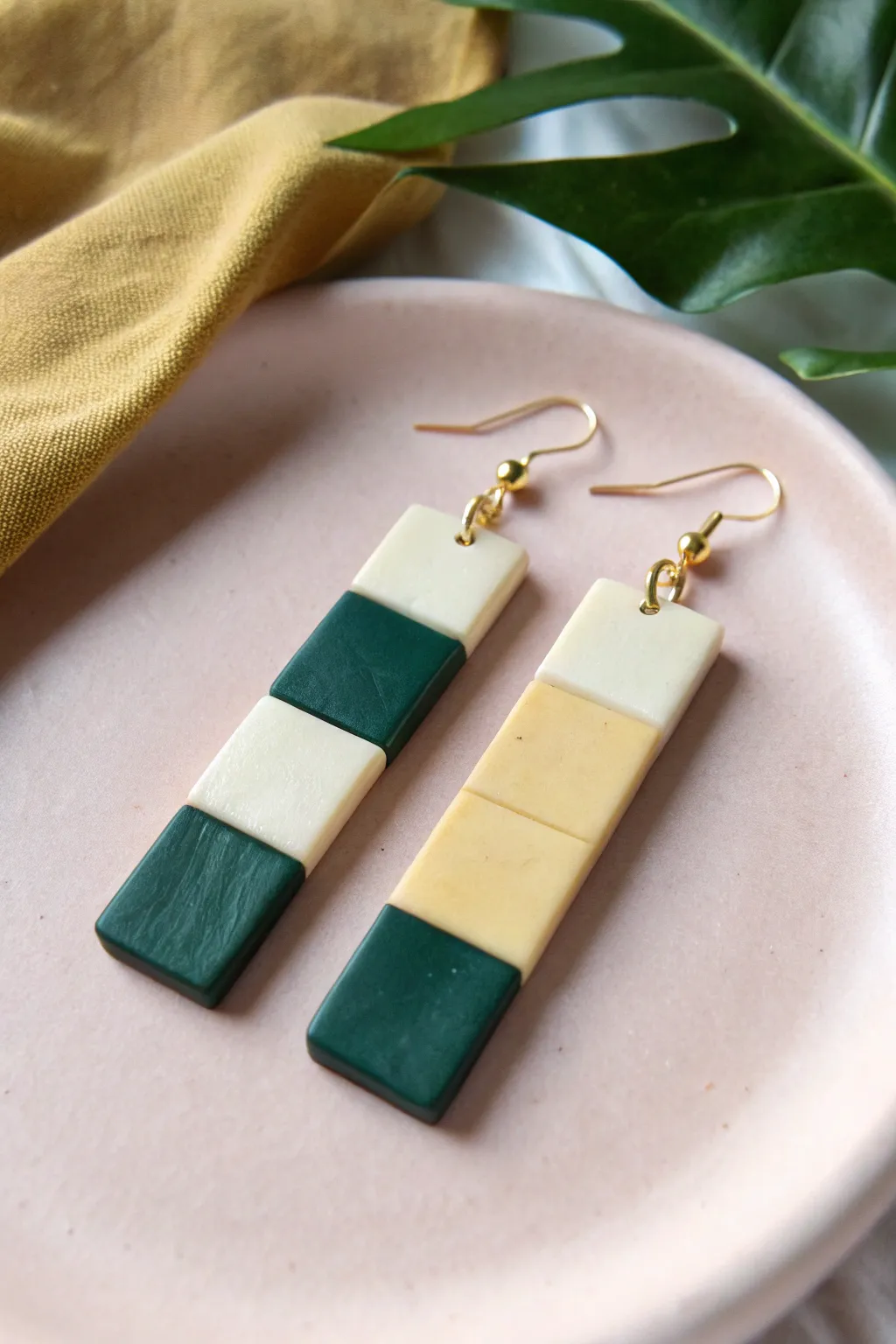 Cream and deep green color-block rectangle earrings with crisp lines, minimal and modern