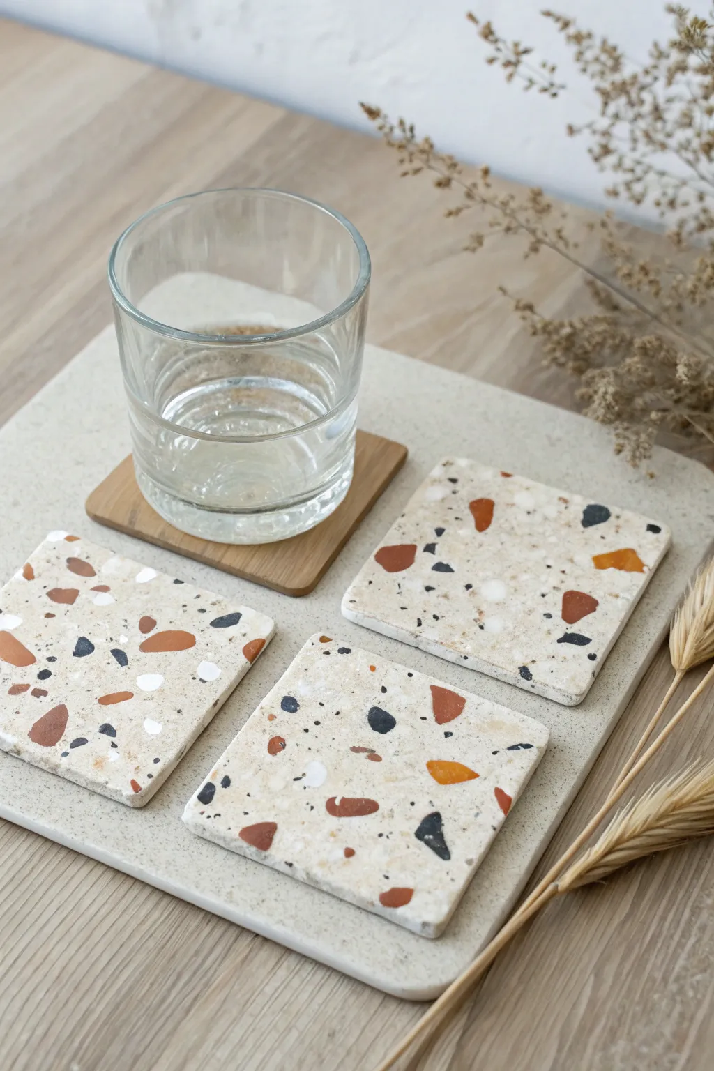 Neutral terrazzo polymer clay coasters, a chic modern gift for your decor loving friend.