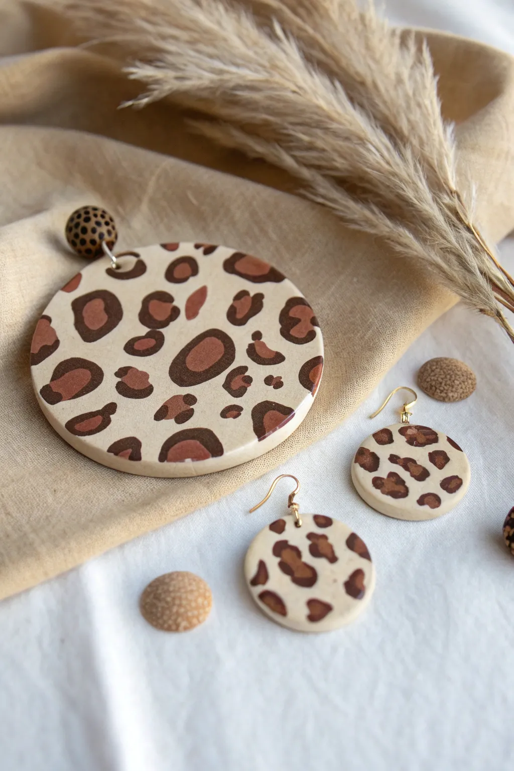 Neutral leopard tear-and-press slab with tiny earrings, minimalist boho polymer clay inspo