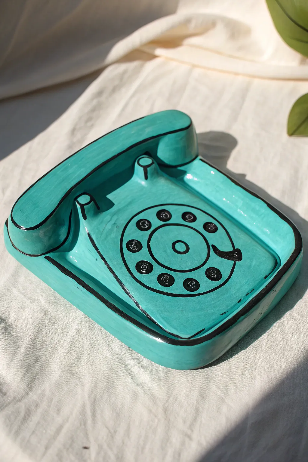 Pop art retro phone trinket dish in bold teal with black outlines, minimal and craft-forward