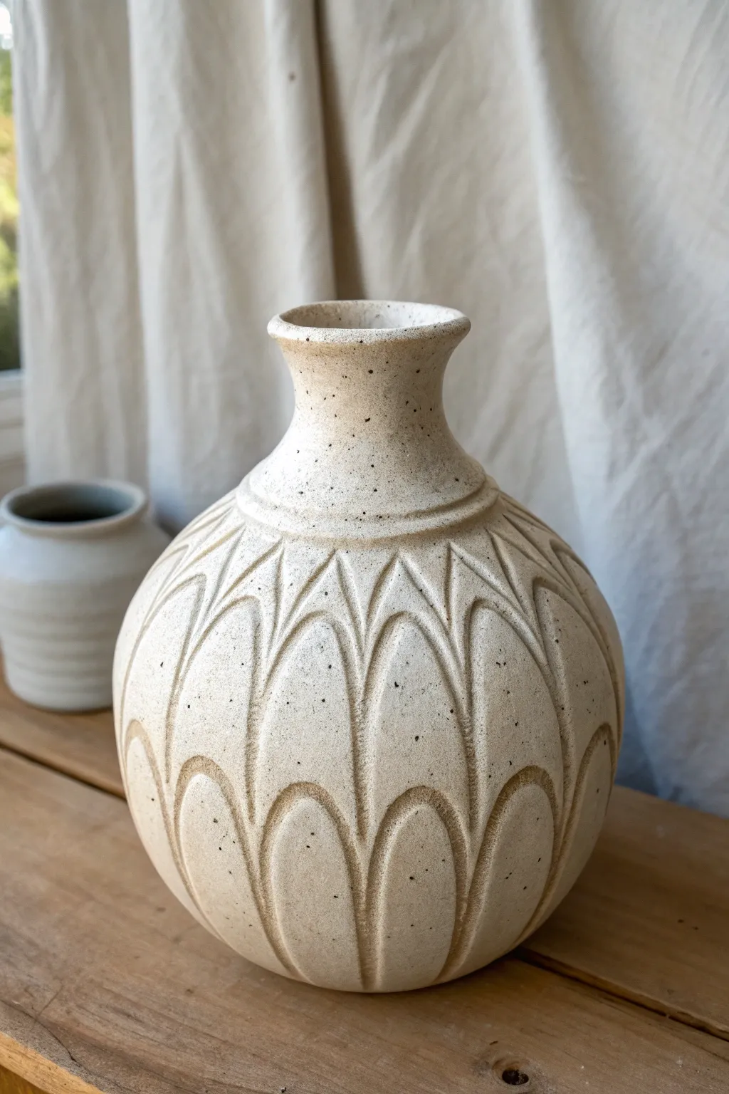 Soft scalloped carving adds a petal-like rhythm to a simple vase, elegant and beginner-friendly