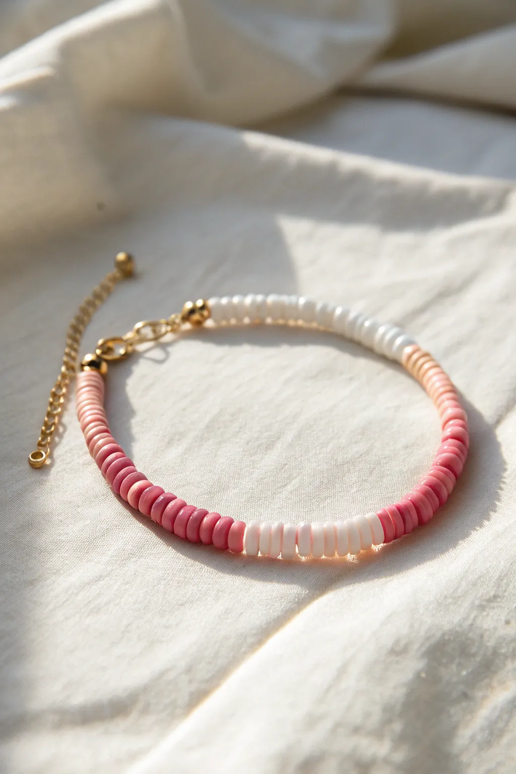 Pink-to-white ombre heishi bracelet in bright natural light for a fresh, preppy look