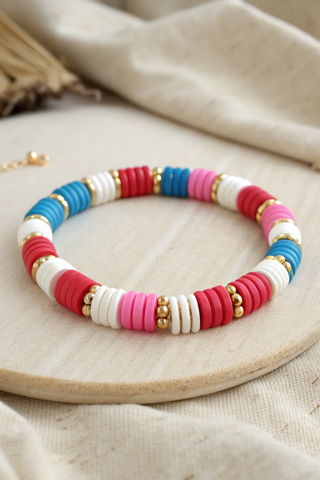 Preppy color-block clay disc bracelet with clean white breaks and tiny gold spacer beads