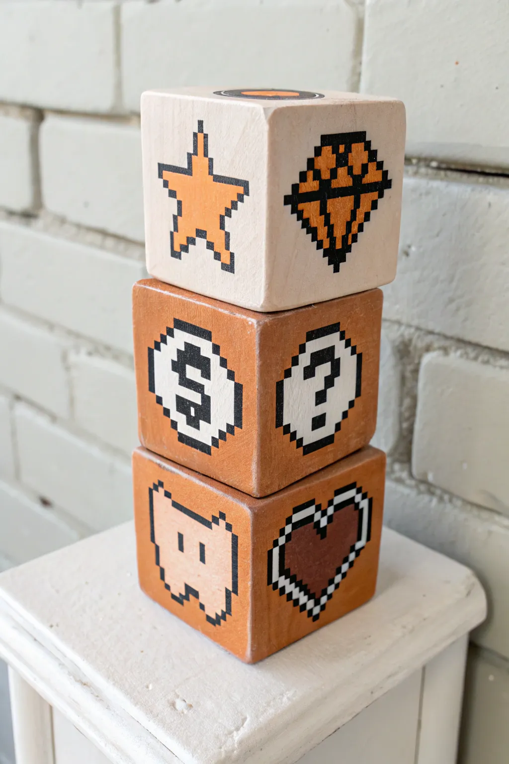 Pixel-inspired clay mystery blocks in soft neutrals, a minimalist gaming accent for your shelf.