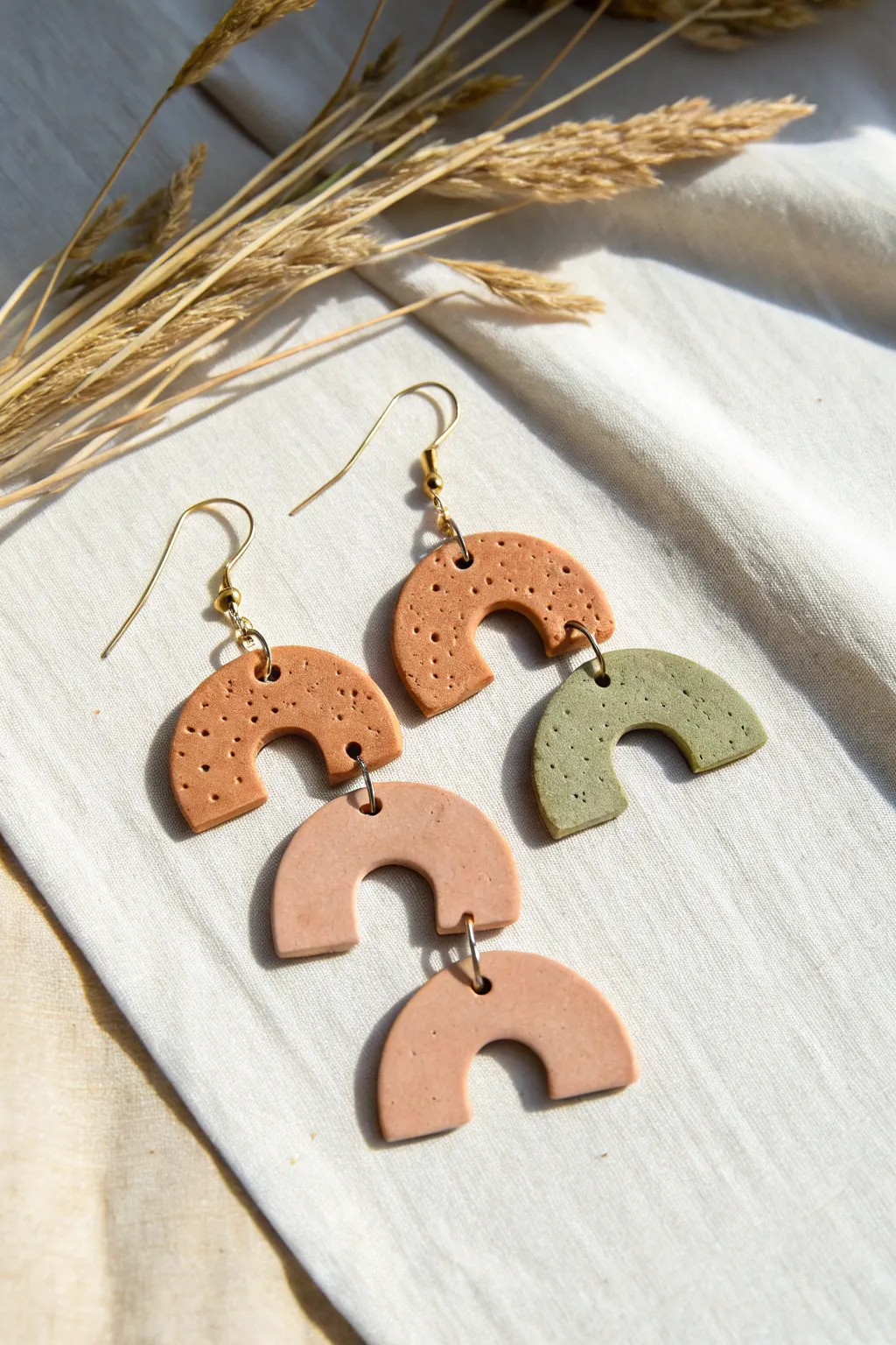 Minimal geometric air-dry clay earrings in earthy tones, perfect for a simple boho look