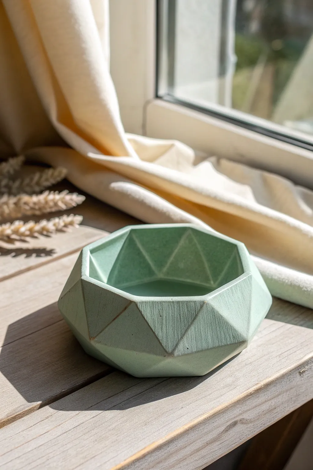 Gem-like faceted air dry clay ashtray in satin sage, a minimalist statement piece for any nook.