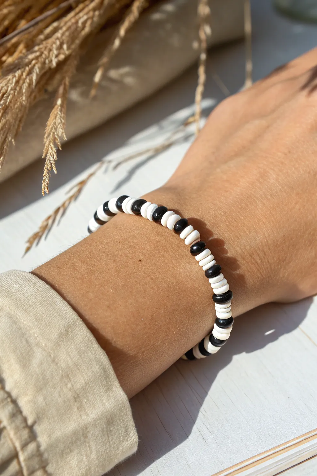 Bold black-and-white heishi bracelet for a crisp minimalist look with a hint of boho charm.