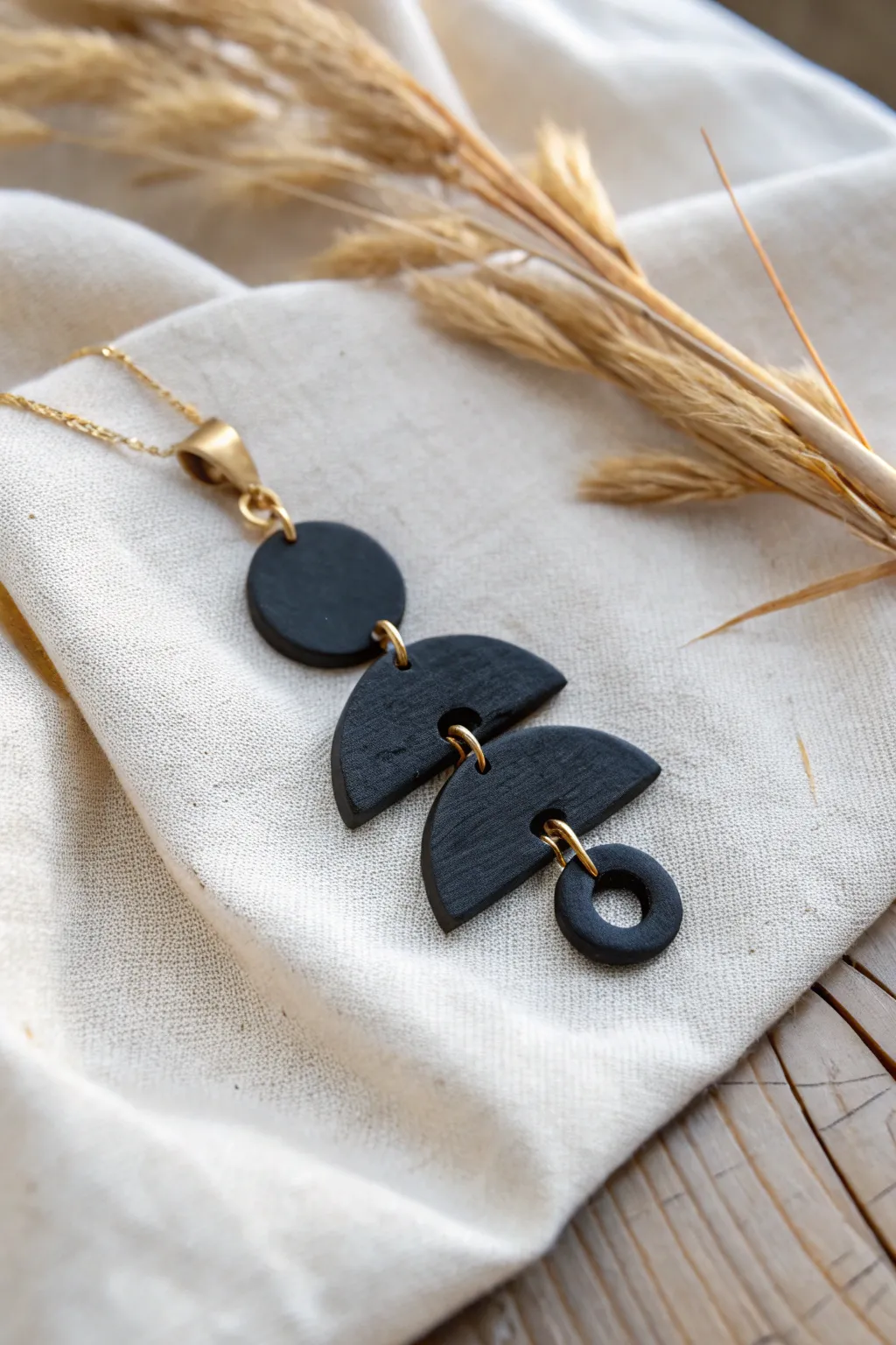 Matte black air dry clay charm with brass rings, minimalist statement jewelry with no paint