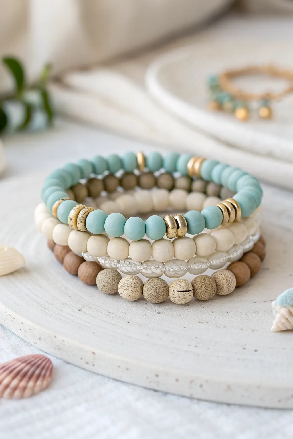 Coastal color-block clay bead bands in sand and sea-glass tones for an effortless stack.