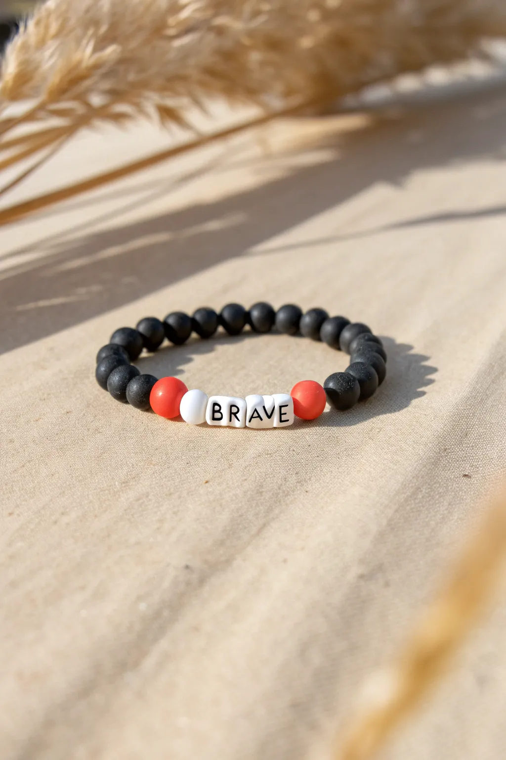 Sporty clay bead bracelet with bold letter beads and a pop of color for fearless vibes.