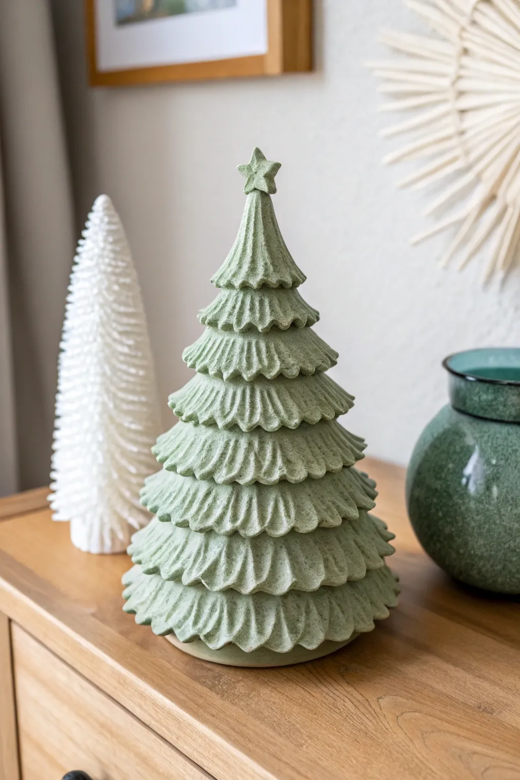 Matte ruffled clay Christmas tree in sage green with a soft white accent, minimalist and cozy