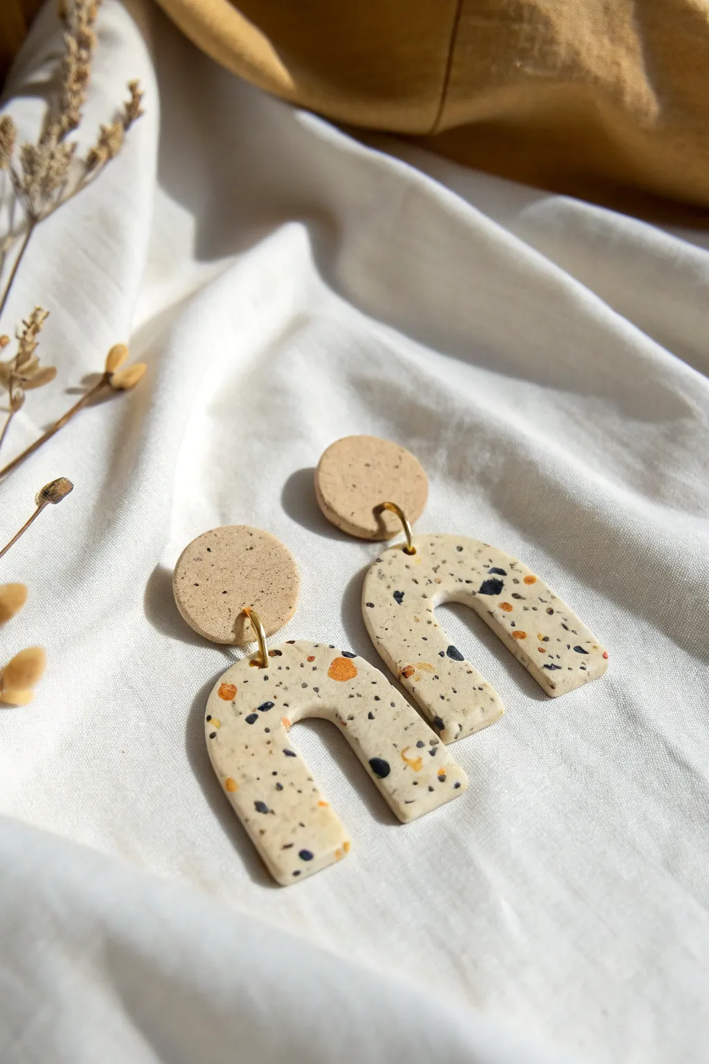 Minimal terrazzo polymer clay arches and circles, clean Scandinavian style with soft boho warmth.