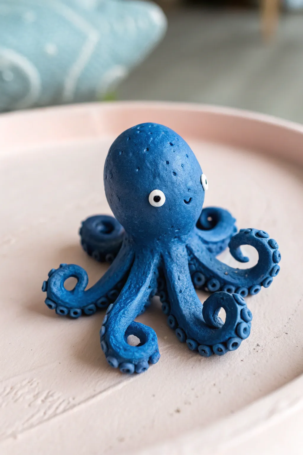 Sweet cobalt octopus with curly tentacles, a simple beginner-friendly clay figurine idea.