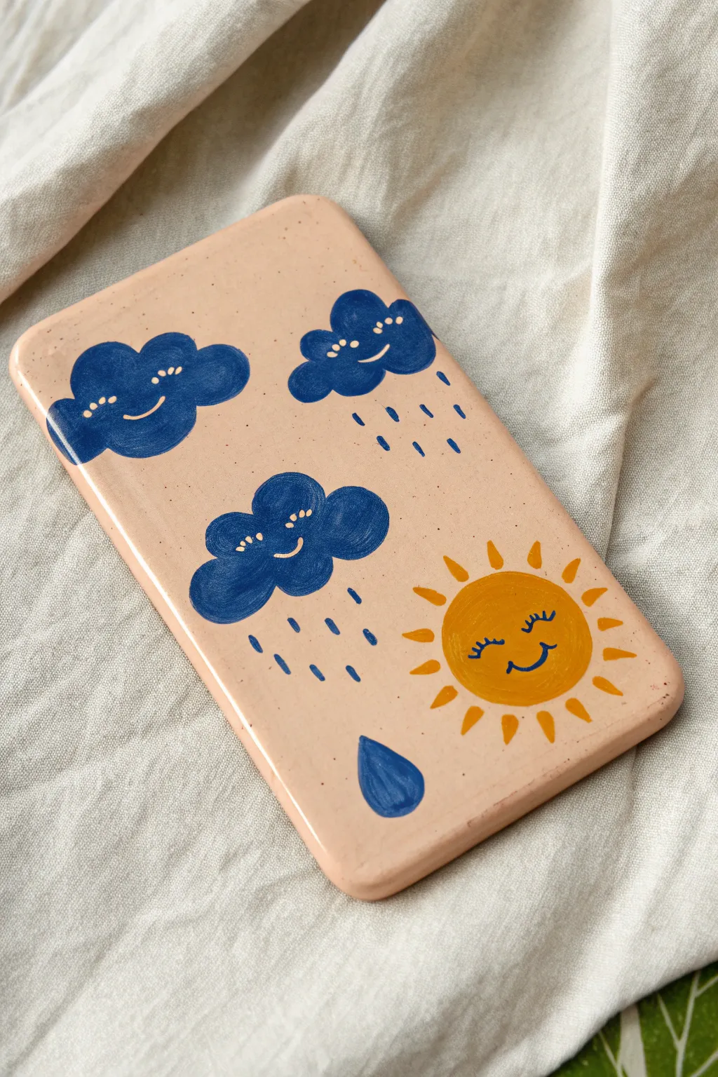 Sunny weather tile in cobalt blue and warm yellow, a simple kindergarten clay project to love.