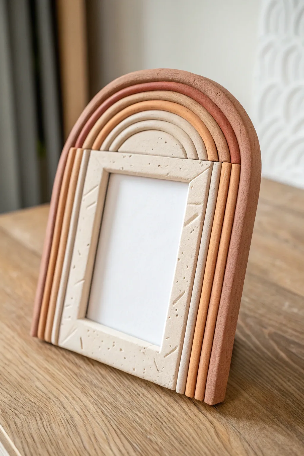 Boho rainbow arch clay frame in warm earthy tones for a cozy minimalist gallery moment.