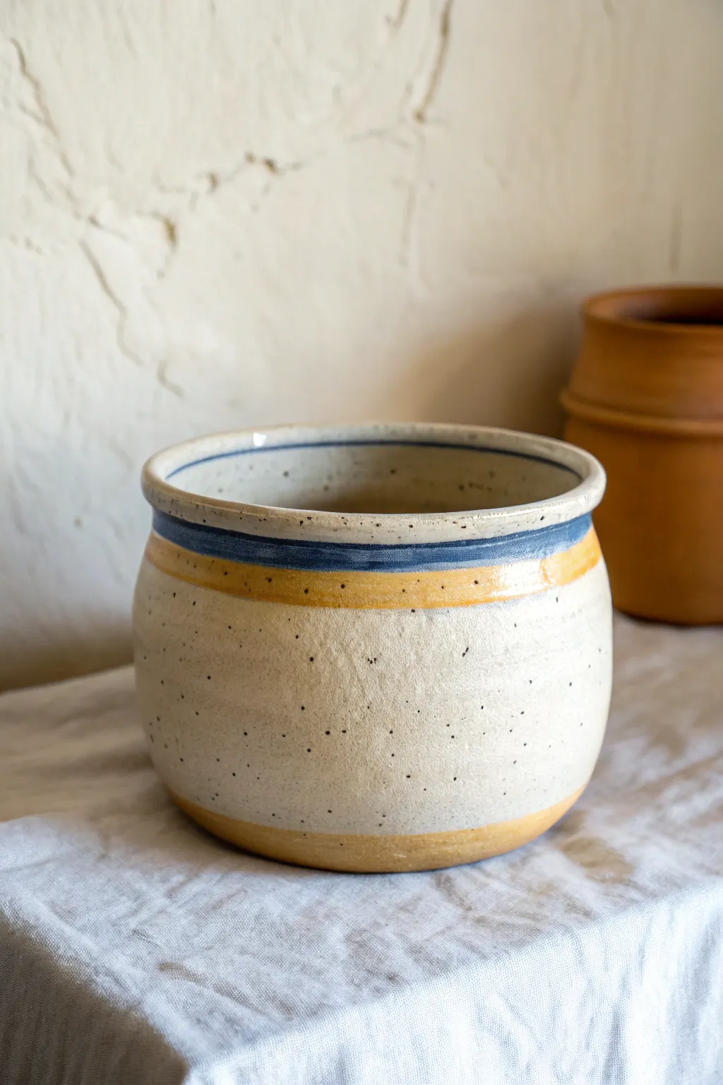 Raw terracotta pot with a single painted rim for a clean, modern color accent.