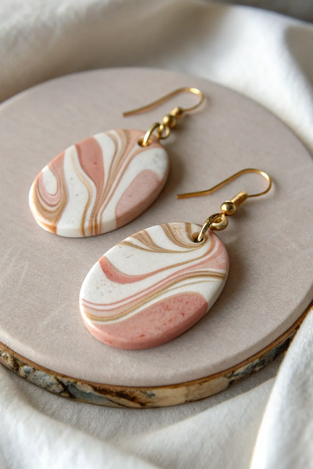 Soft marble swirl polymer clay drops in blush, ivory, and sand for an easy handmade look