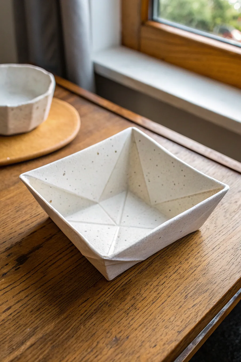 Paper-look folded slab catchall tray in matte clay, crisp creases and cozy minimalist vibes.