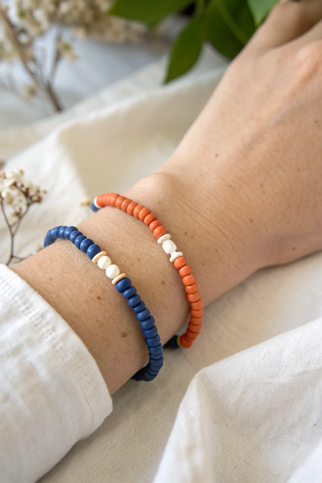 Bold blue and terracotta heishi beads with soft neutral spacers for an easy color pop.