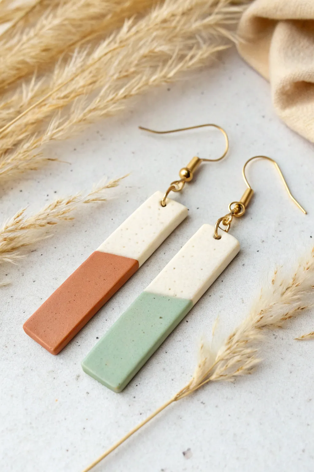 Minimal color-block skinny bar earrings in soft clay tones, clean lines, Scandinavian boho vibe.