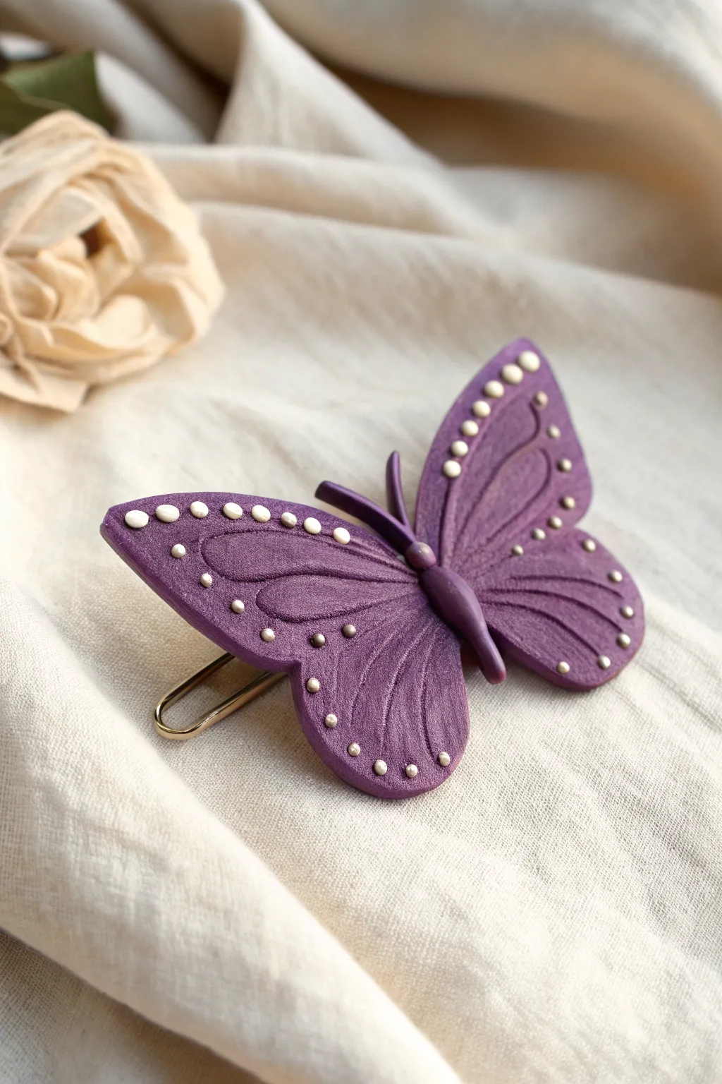 Violet butterfly clay hair clip topper with dotted wings, simple, sweet, and wearable.