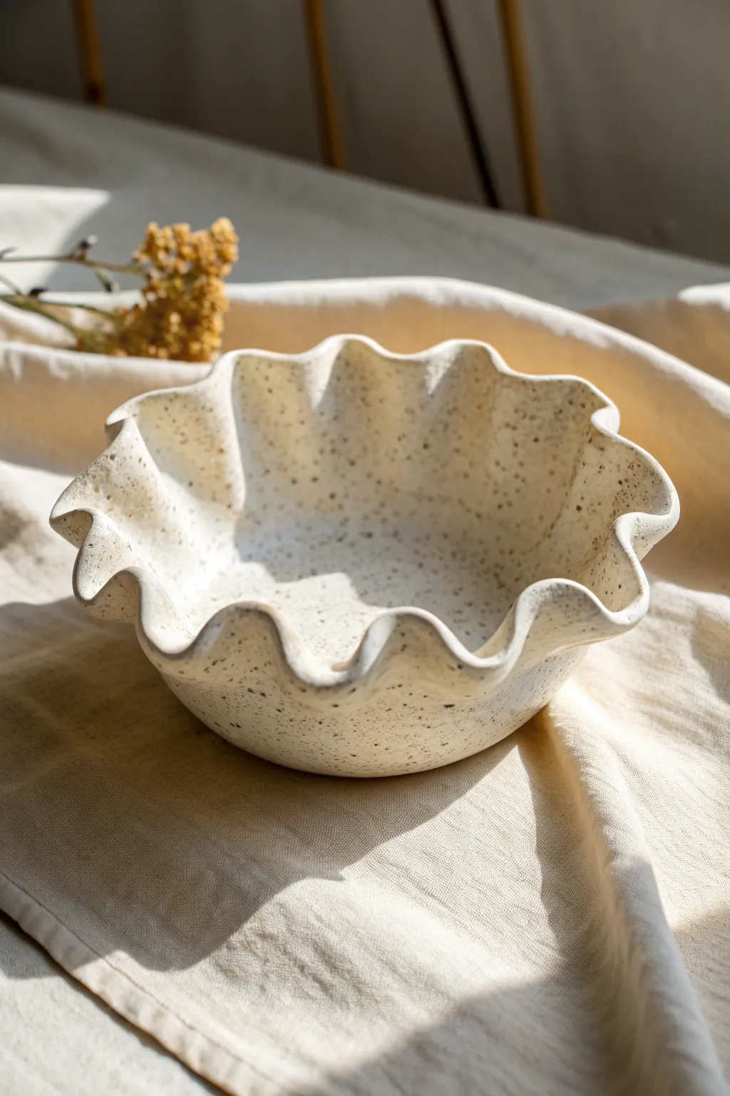 Soft slab catchall with a ruffled petal rim, minimalist and boho, perfect for jewelry or keys.