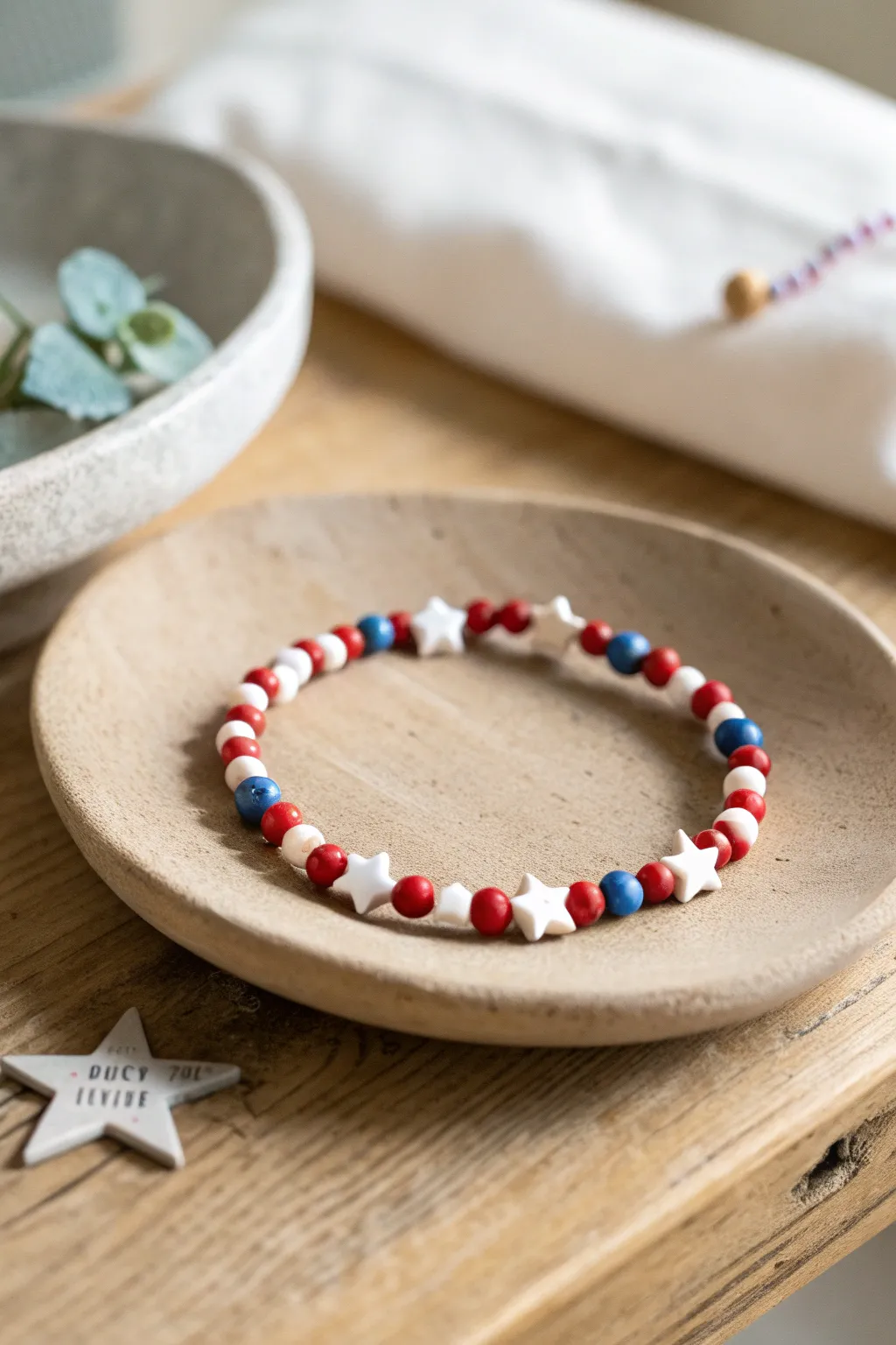 Simple USA clay bead bracelet with spaced star accents in red, white, and blue for July 4.
