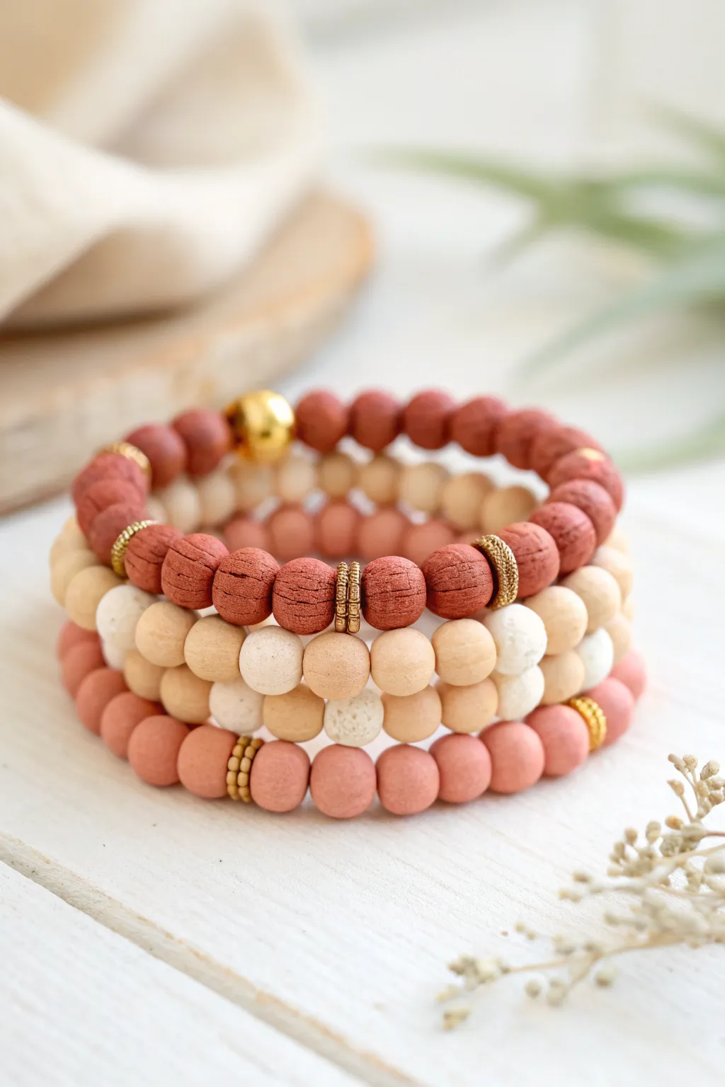 Gold-kissed clay bracelet stack in classic Valentine tones, simple, handmade, and chic.