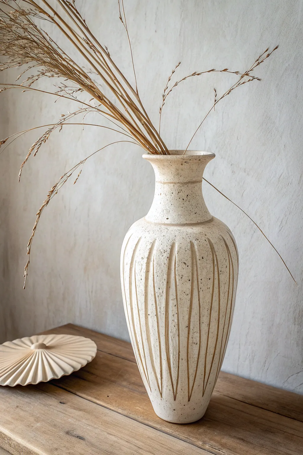 Tall wide-mouth vase with fanned stems and leaning lines for a calm sculptural statement.