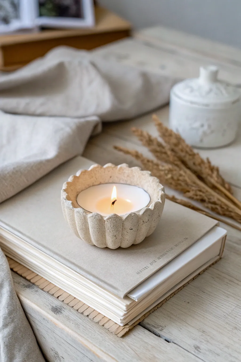 Soft beige scalloped tea light holder for cozy minimalist-boho vibes on your shelf.