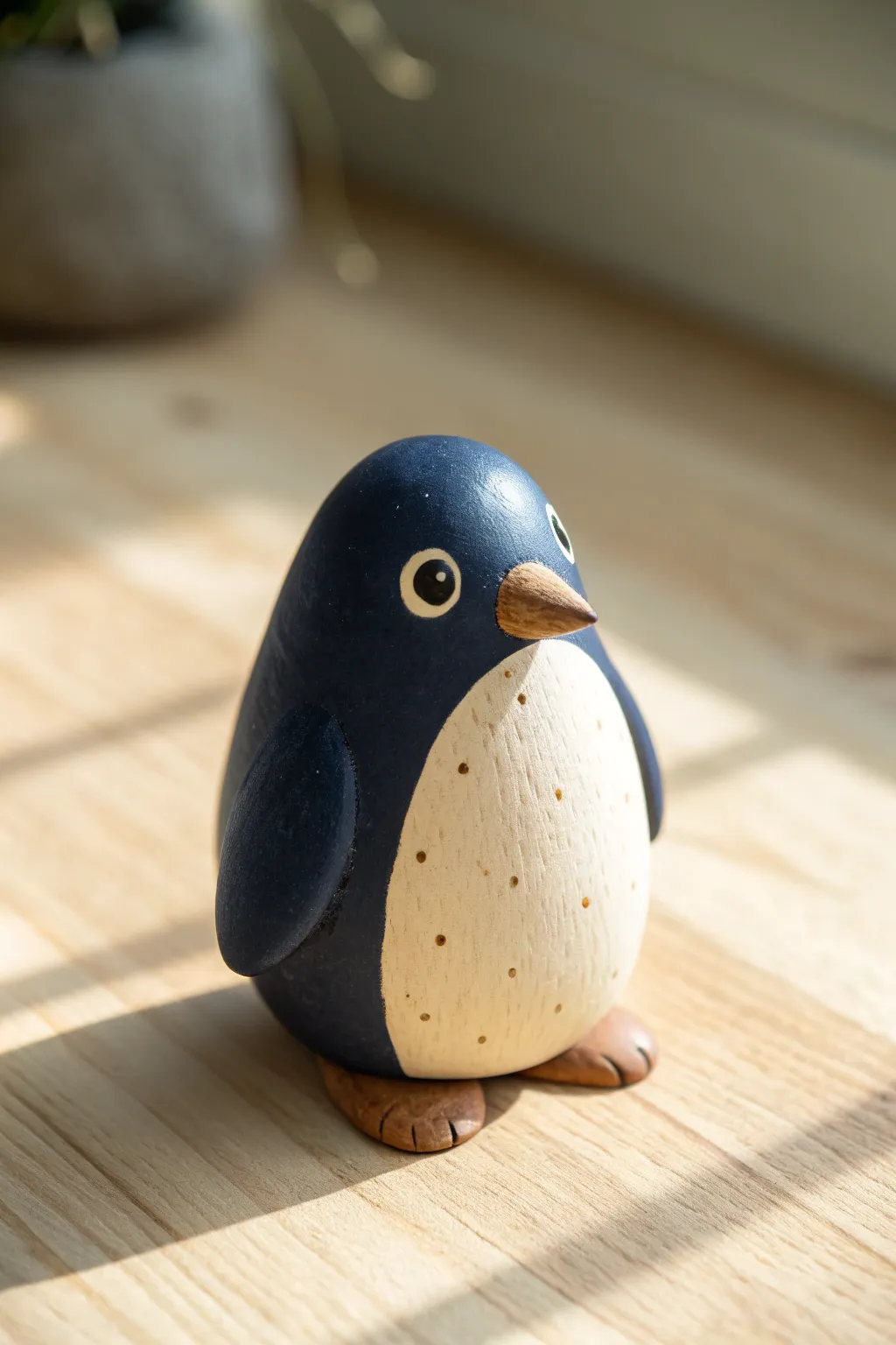 Make this baby penguin: egg-shaped body, creamy belly patch, tiny flippers and dot eyes.