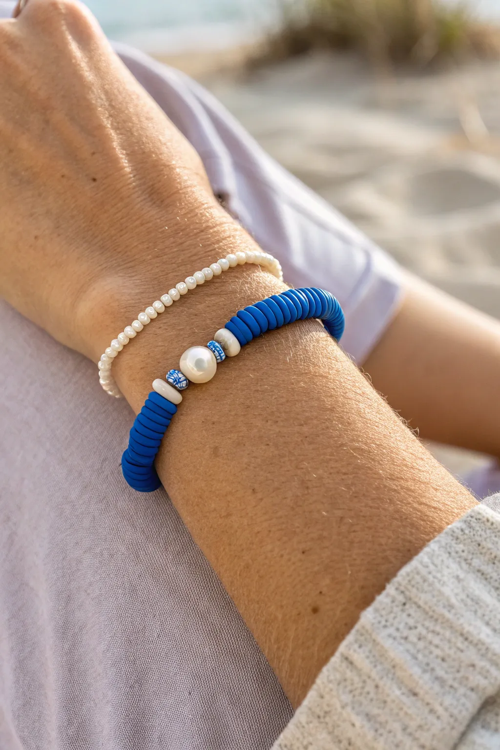 Beach-chic blue clay heishi bracelet with pearl accents, minimal Scandinavian style