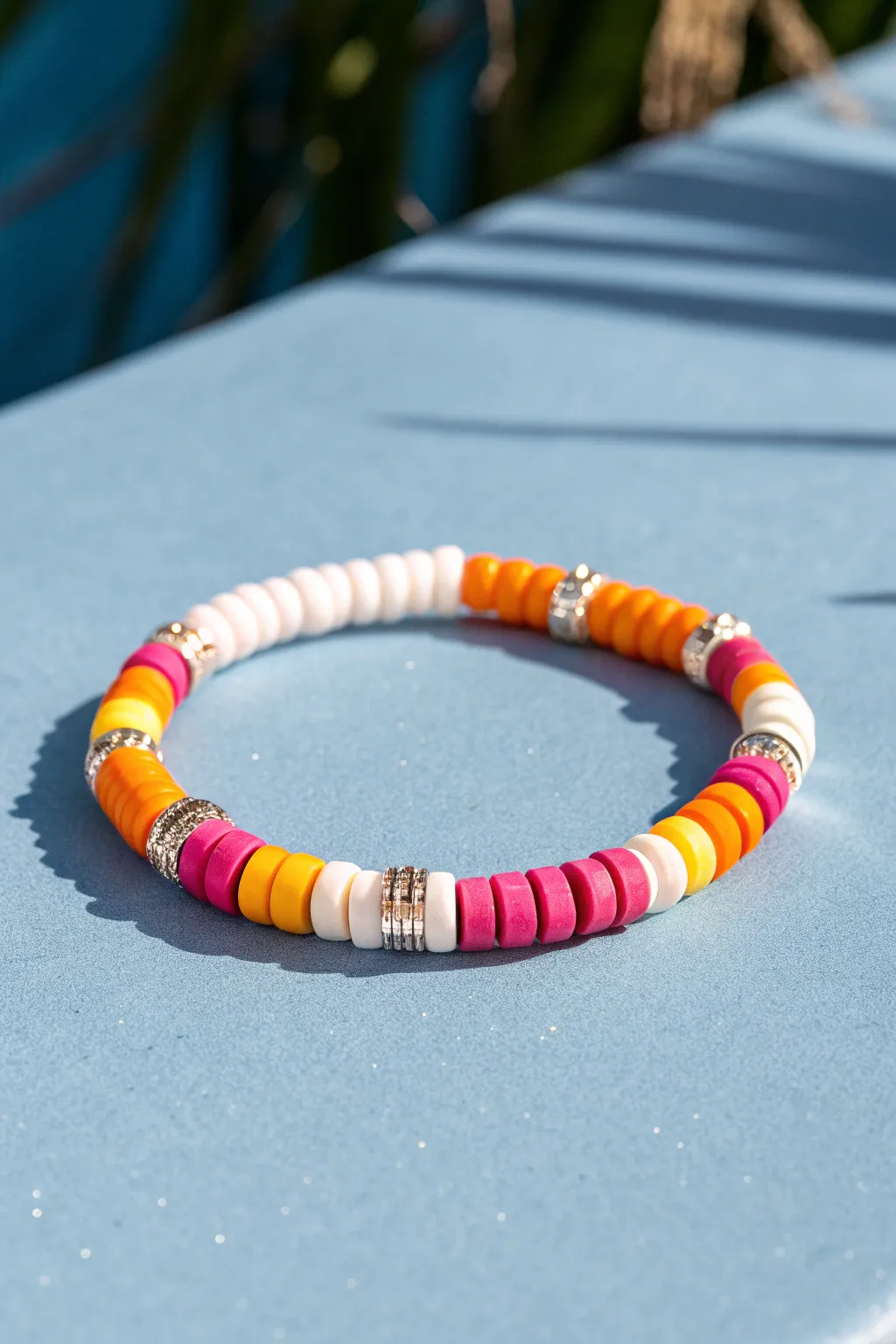 Hot pink, orange, yellow and white heishi bead bracelet for a bright preppy pop vibe.