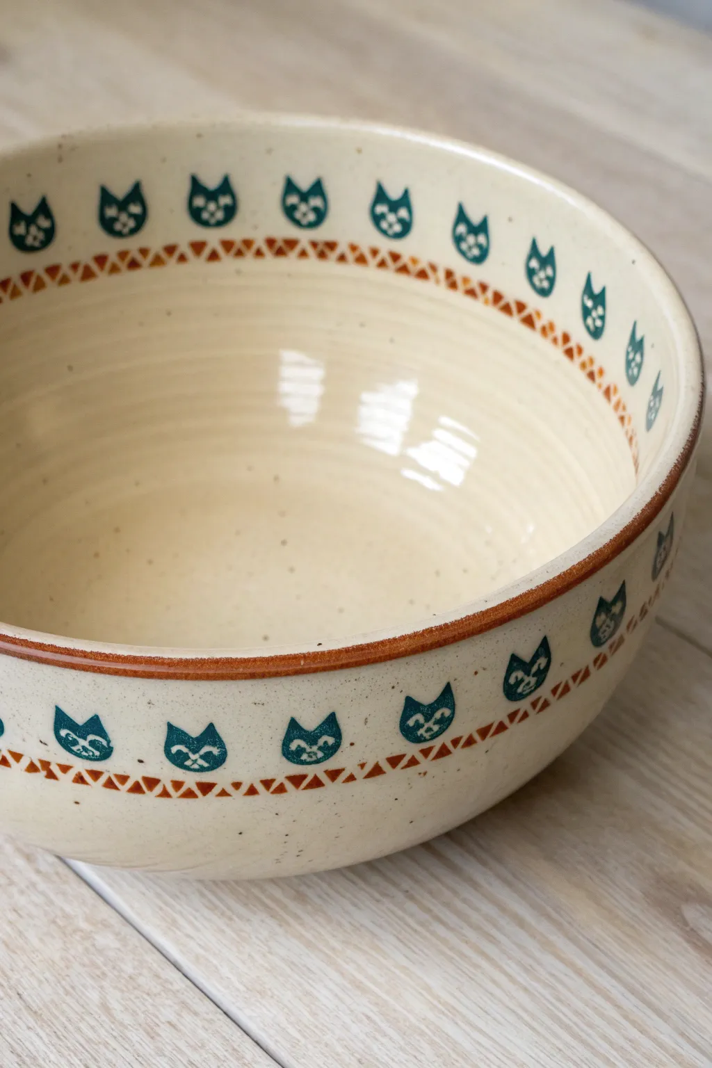 Wide bowl with cute cat faces and paw print border, clean interior, modern boho glaze.