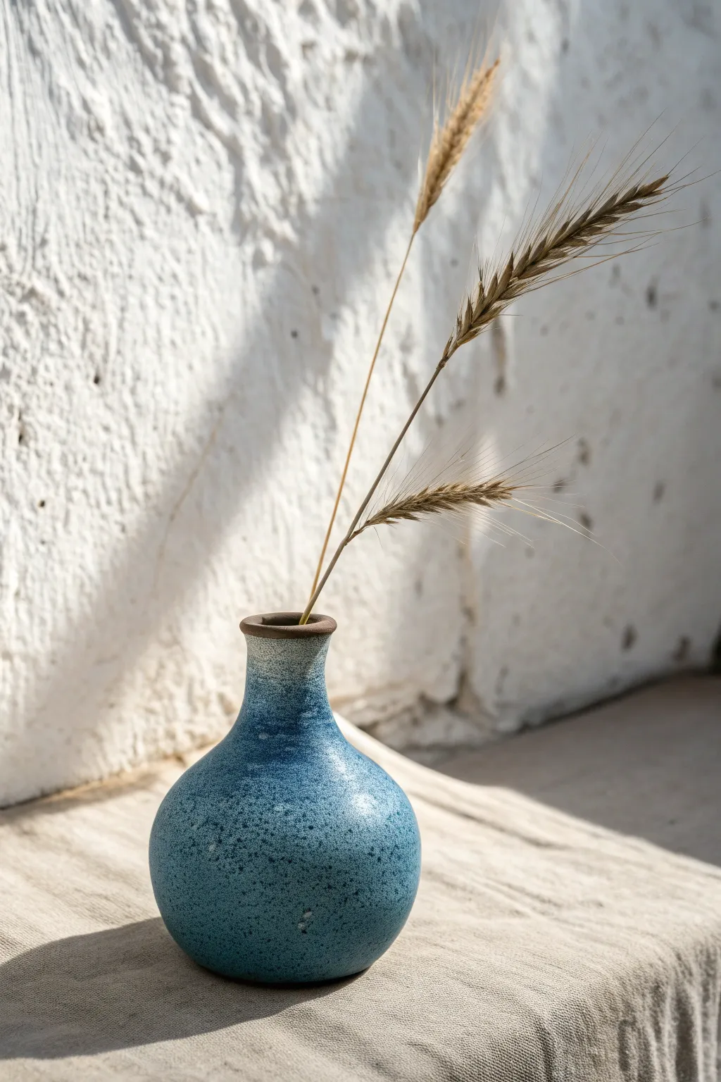 Mini bud vase idea: one simple stem, bold matte glaze, and calm Scandinavian boho styling
