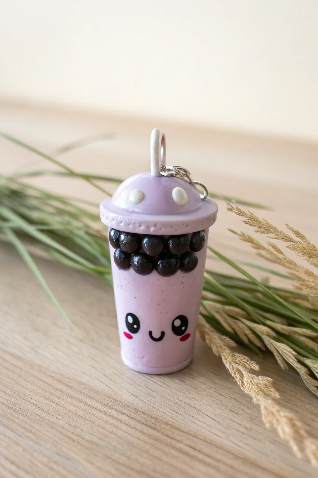 Sweet boba cup charm with straw detail, pastel glaze and bold boba dots, perfect for keychains.