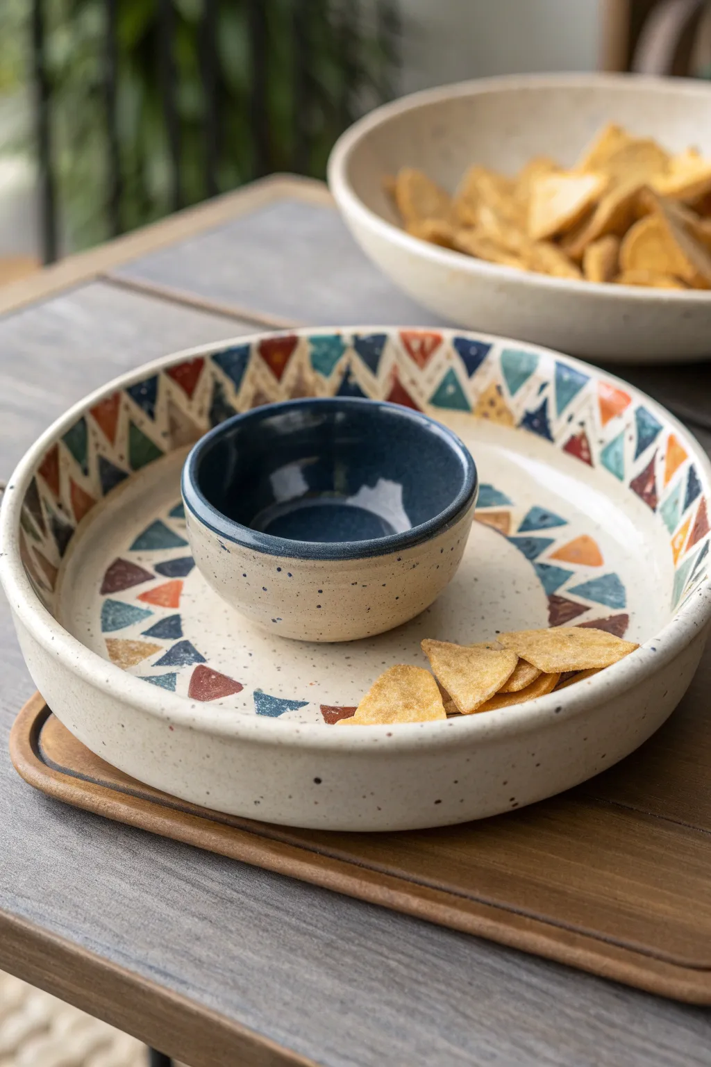 Modern terrazzo paint chips on a neutral chip ring with a bold charcoal dip well for contrast