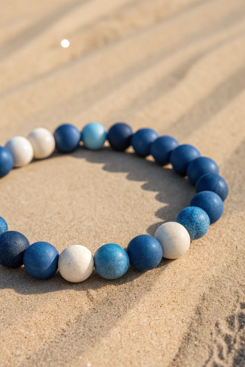 Blue monochrome ombré clay bead bracelet from navy to sky, a clean minimalist color fade.