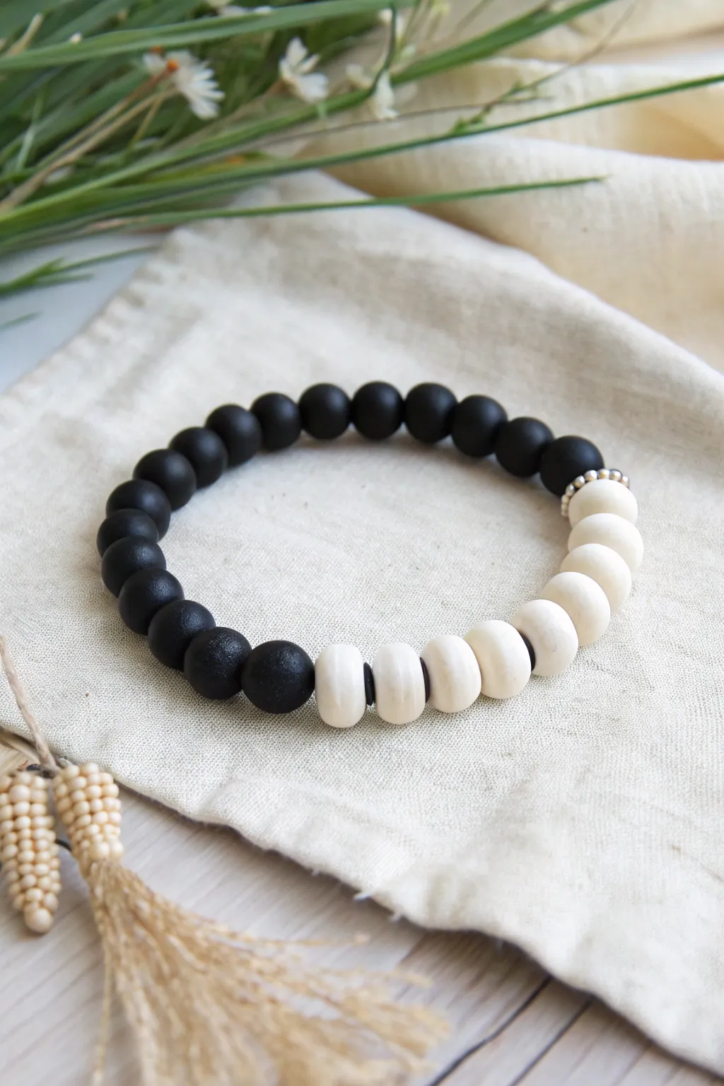 Bold black and white clay bead bracelet with a clean graphic pattern, minimalist and modern.