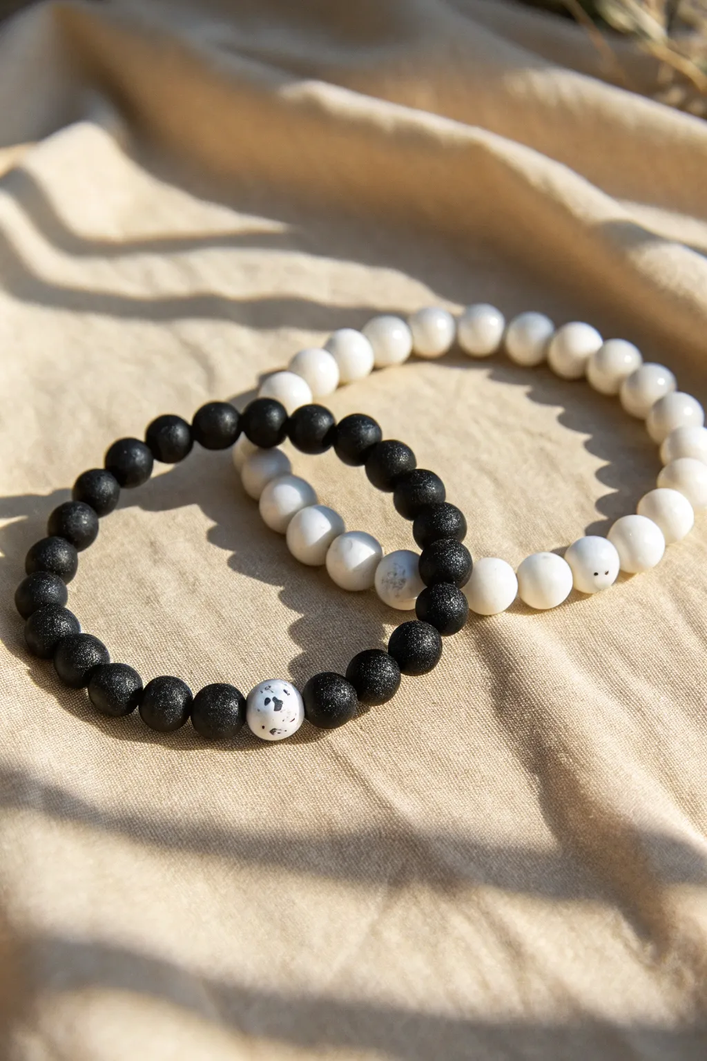 Yin-yang clay bead bracelets in bold black and white for a minimalist boho look