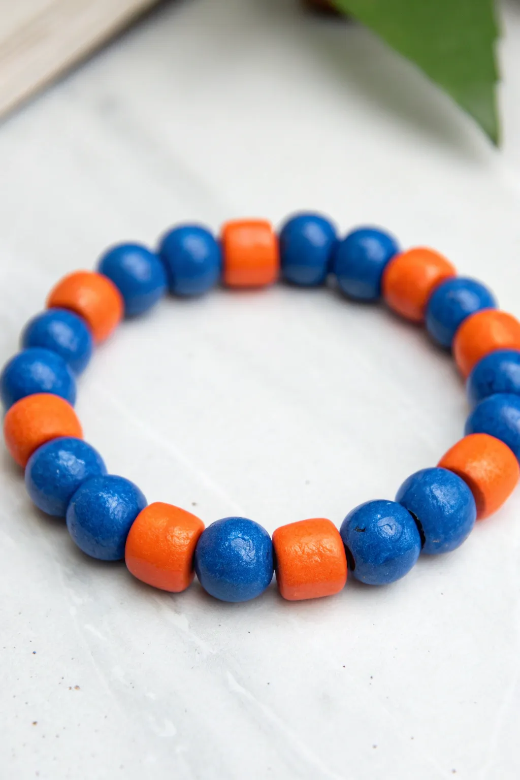 Bold complementary clay bead blocks in blue and orange for a clean, sporty, high-contrast look.
