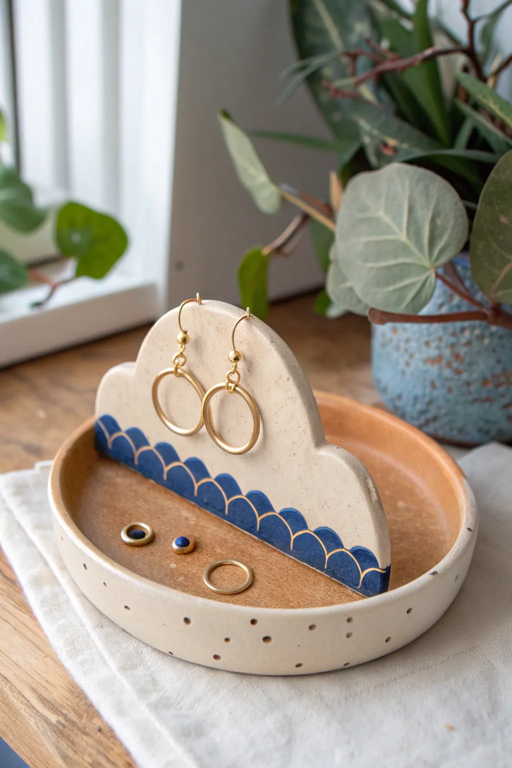 Wavy clay ridge stand keeps hoops and studs organized with sculptural minimalist charm.